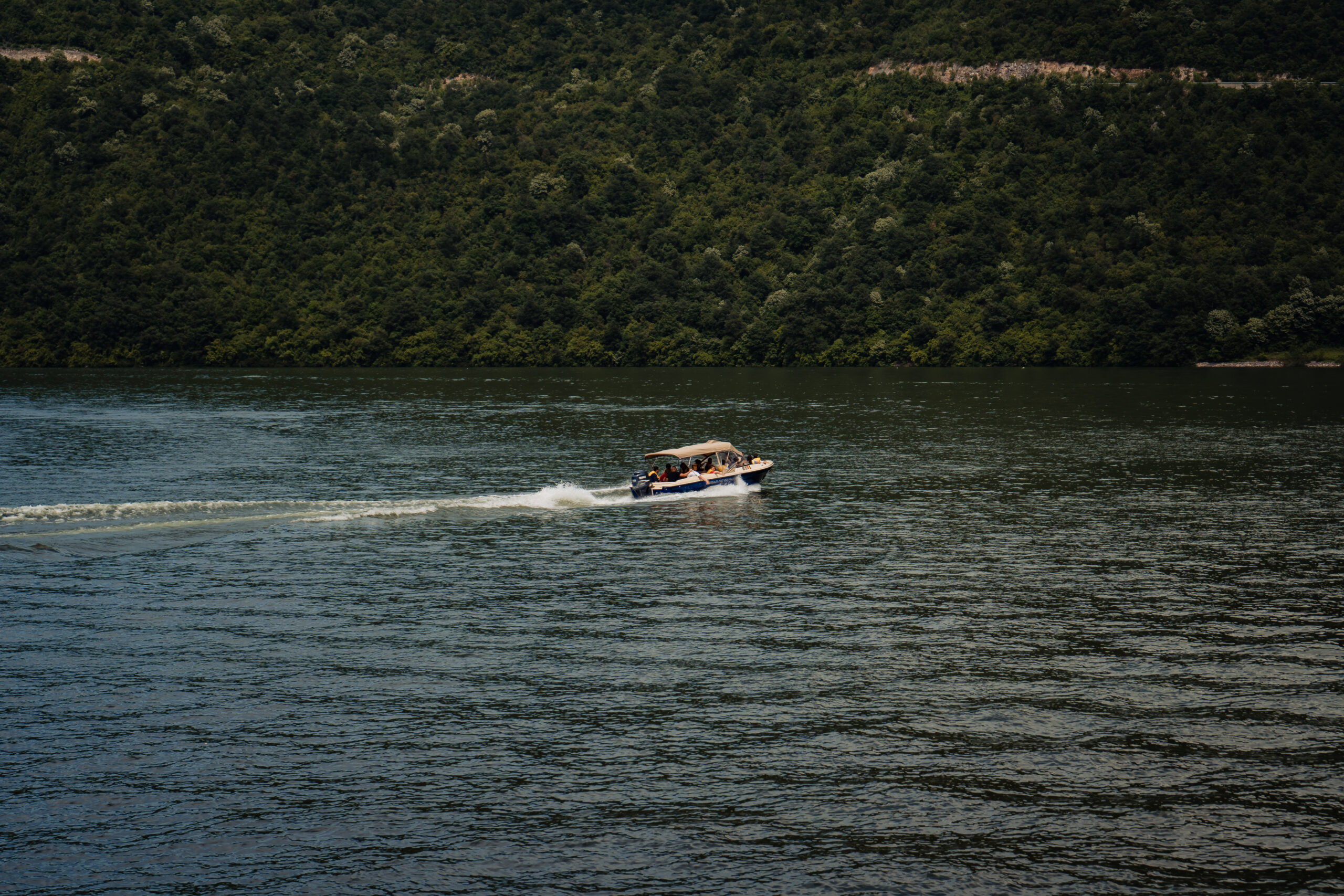 A motor boat moving on the beautiful lake